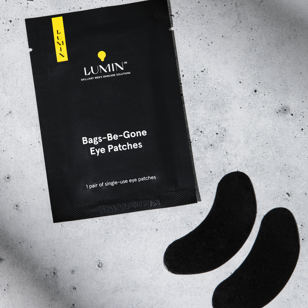 Lumin Bags-Be-Gone single-use men's eye patches with black curved gel patches for under-eye bag reduction and skincare.