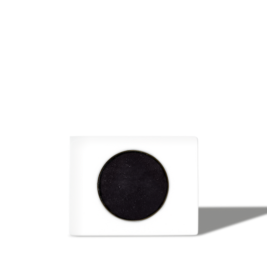 Square white ceramic charcoal air purifier with round black activated charcoal filter, modern eco-friendly odor absorber.