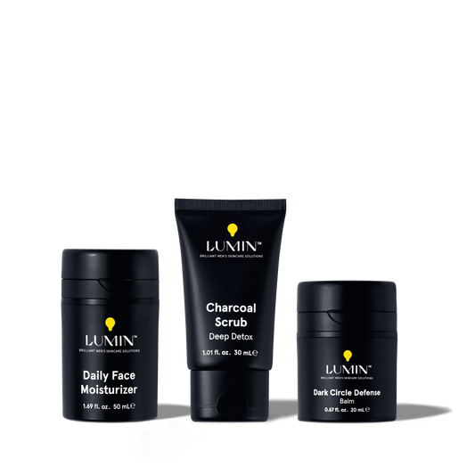 Lumin men's skincare set featuring Daily Face Moisturizer, Charcoal Scrub Deep Detox, and Dark Circle Defense Balm.
