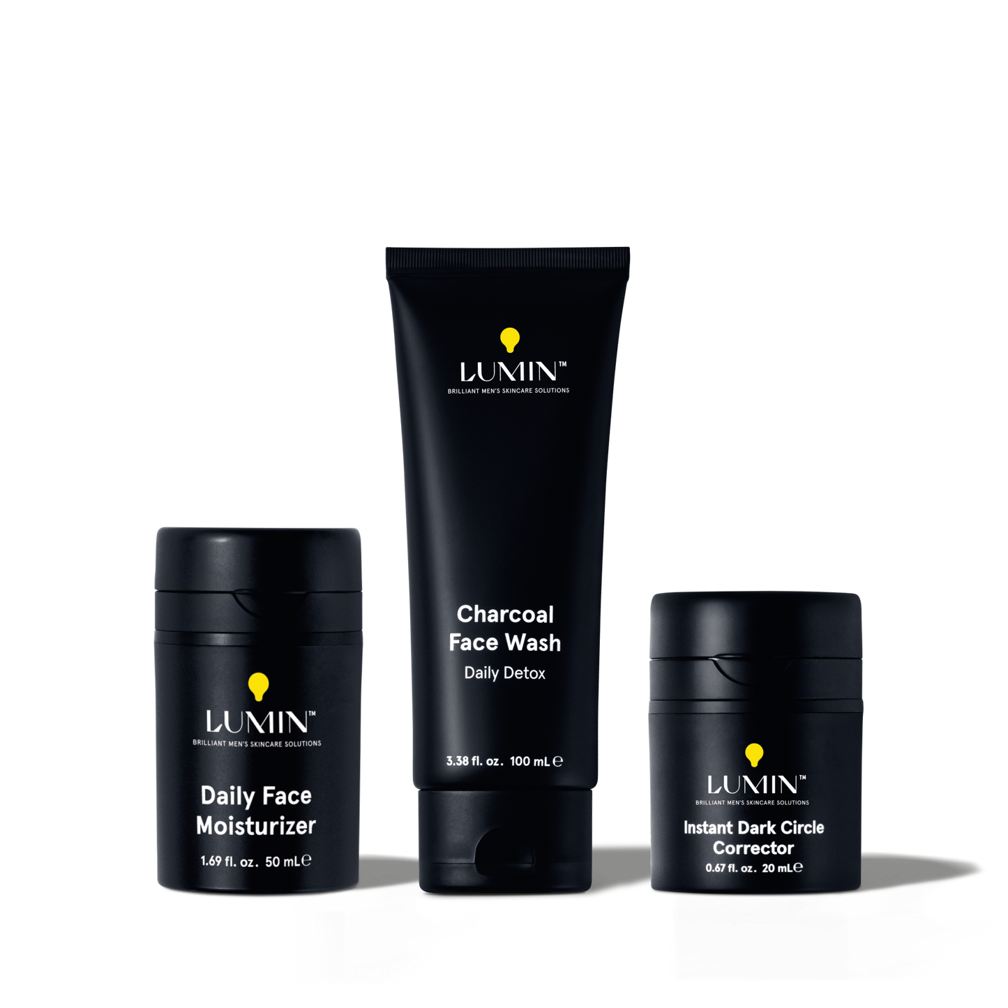 Lumin men's skincare set with charcoal face wash, daily face moisturizer, and instant dark circle corrector in black packaging