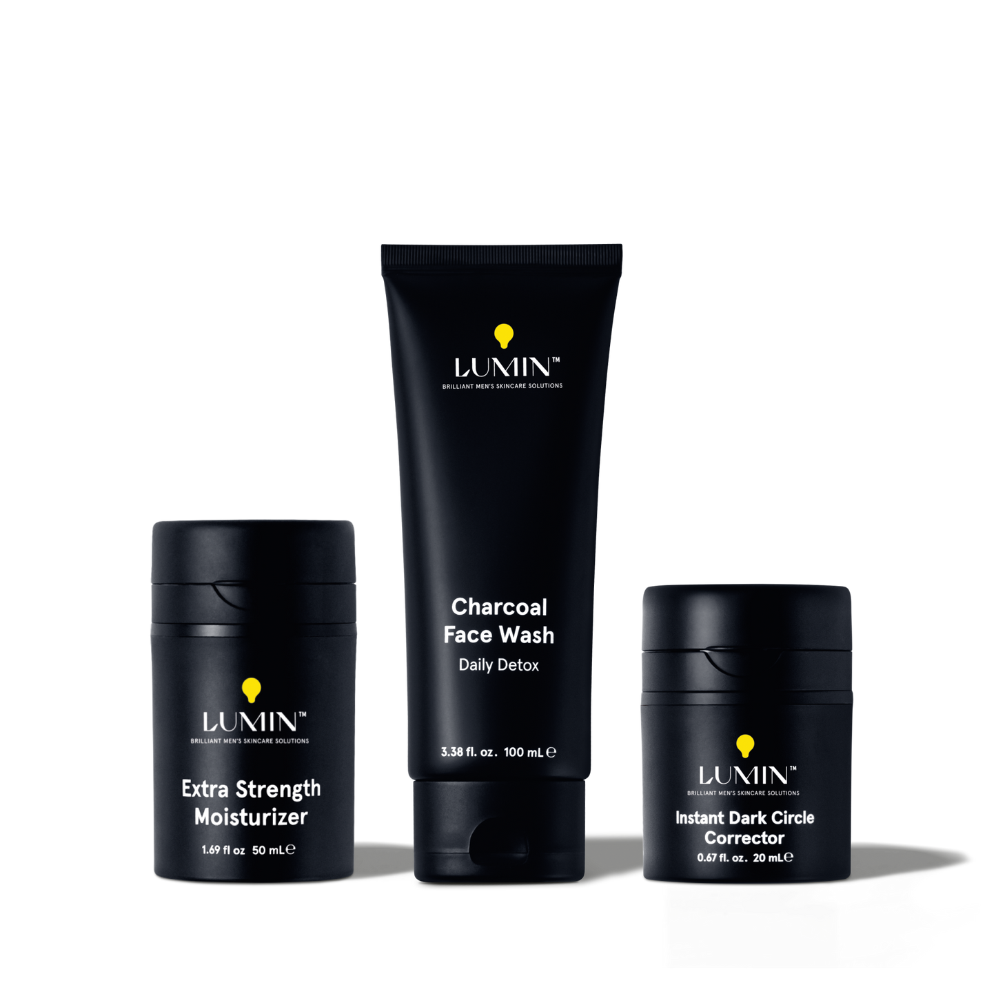 Lumin men's skincare set with Extra Strength Moisturizer, Charcoal Face Wash Daily Detox, and Instant Dark Circle Corrector.