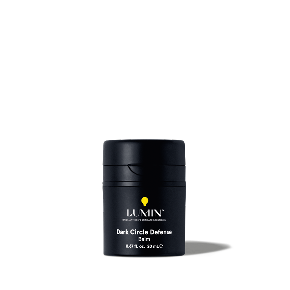 Lumin Dark Circle Defense Balm in black container, men's skincare product for reducing dark under-eye circles, 0.67 fl oz.