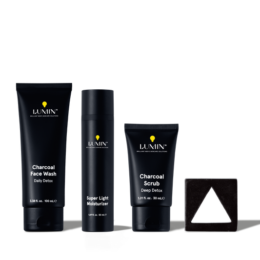 Lumin men's skincare set with charcoal face wash, super light moisturizer, charcoal scrub, and triangular black soap bar