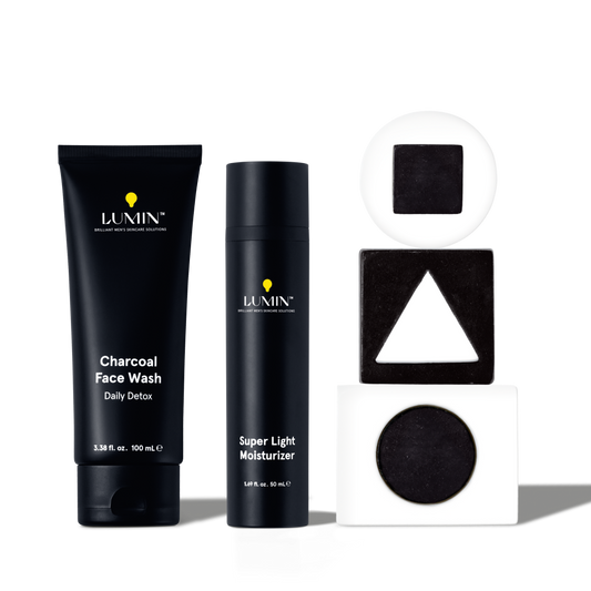 Lumin men's charcoal face wash and super light moisturizer with black and white geometric shapes for skincare routine.