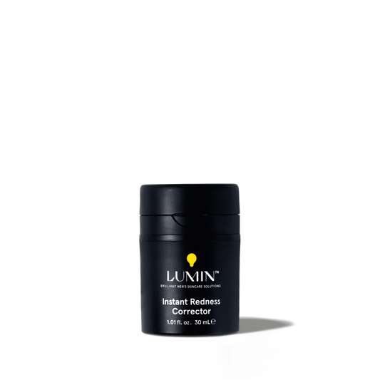 Lumin Instant Redness Corrector skincare product for men, 1.01 fl. oz. black travel-size container with yellow logo.
