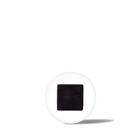 White pill with a black square imprint, medicine tablet for prescription or over-the-counter use.